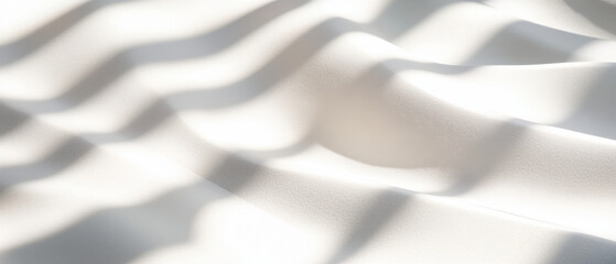 Fototapeta premium Soft white fabric with layered shadows and highlights creates serene atmosphere. gentle waves and textures evoke sense of calm and elegance