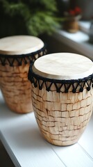Fototapeta premium A classic wooden tambourine is elegantly positioned on a clean white backdrop, its smooth finish and natural wood grain captured in sharp focus. The high contrast emphasizes the intricate details 