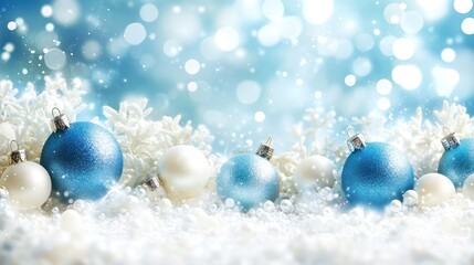 Festive blue and white Christmas ornaments in snow.