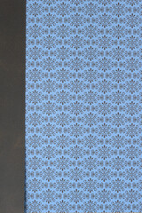 decorative scrapbooking paper with repeating decor pattern and solid border