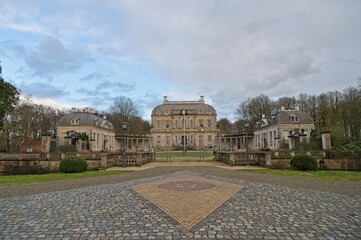 The imposing Huis De Voorst near Eefde under a beautiful sky at the end of a winter day.