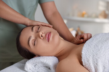 Fototapeta premium Young woman receiving massage in spa salon