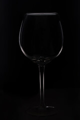 Empty glass close-up on a black background, outline highlighted