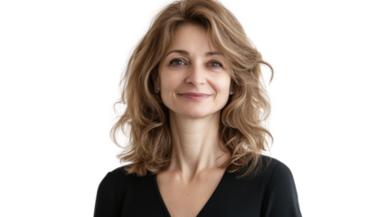A professional woman with long wavy hair smiles confidently at the camera. She radiates warmth and approachability in a modern setting.