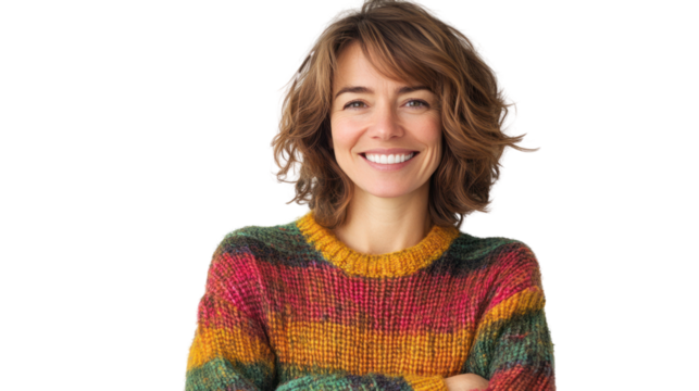 A cheerful woman with curly hair in a colorful sweater, exuding joy and warmth, perfect for conveying happiness and positivity in various contexts.