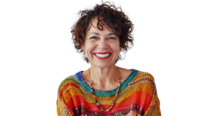 A cheerful woman with curly hair smiles warmly, showcasing a vibrant and colorful sweater, embodying confidence and positivity.