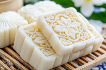 Delicate traditional Chinese cake with intricate floral designs, beautifully arranged