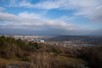 Vibrant Skies Over a Riverside Town