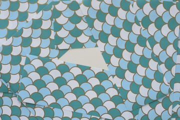 layered blue white and green fan pattern paper sheets