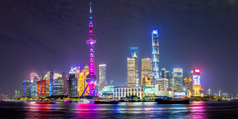 Shanghai skyline at the Bund with Oriental Pearl Tower downtown Pudong panorama at night in China