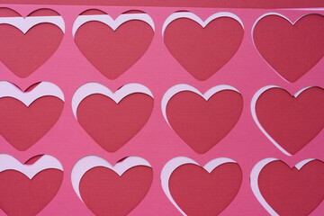 machine-cut paper stencils with heart-shape cutouts