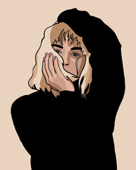 Woman in a black hoodie covering half of her face