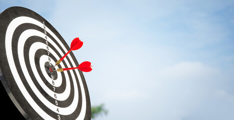 two arrows on target copy space with cloud background