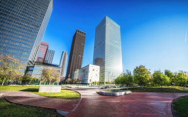 Fototapeta premium Sunny Urban Landscape with Pathways and Skyscrapers