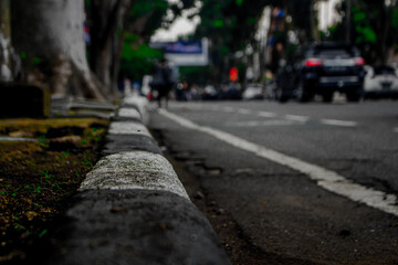 Bustling Bandung Streets Under a Cloudy Sky with Vehicles