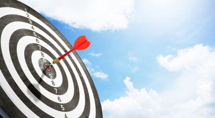 red arrow on target with sunlight background