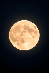 Obraz premium Radiant full moon with visible craters, shining brightly in a serene night sky 