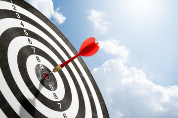 red arrow with blue sky on target for copy space background