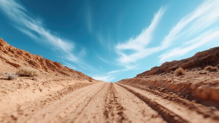A captivating dirt road winding through a rustic landscape under a picturesque sky, inviting seemingly endless possibilities for adventure and exploration.
