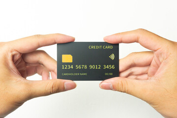 two Hands of young men is holding black mockup credit cart with isolated white background