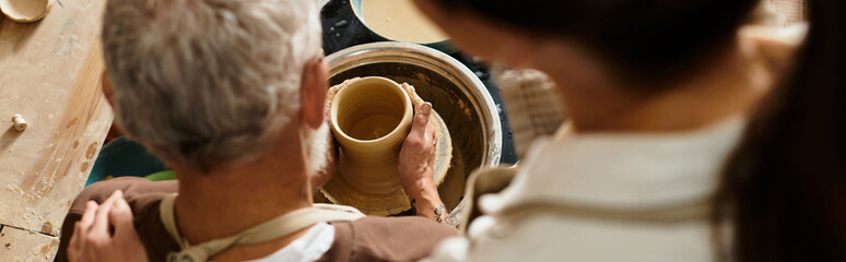 A beautiful couple enjoys shaping clay together in a pottery class, sharing quality time, banner