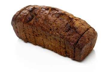 Freshly baked rustic bread loaf on a white background showcasing its texture and color