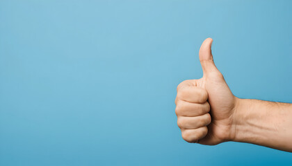 Thumbs up hand gesture with blue background 