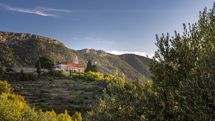 Village of Vrisnik on the island Hvar sunset panorama  with Church of St. Anthony 