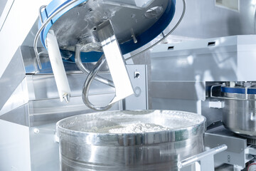 Automated dough mixing in confectionery production facility