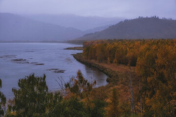 Autumn Lake Markakol in Kazakhstan is located in the Markakol depression, surrounded by the Kurchumsky and Azutau ridges.