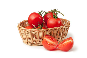 Solanum lycopersicum tomato in a basket and halves