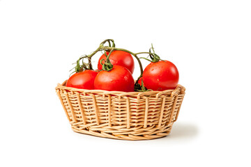 Basket with solanum lycopersicum tomatoes