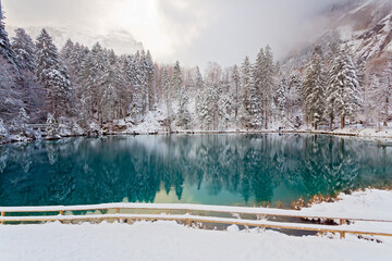 Panoramic view of Lake Blausee in Bernese Highlands during winter, Switzerland