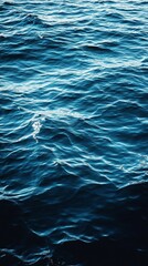 Fototapeta premium A mesmerising view of deep blue ocean waves rolling and glistening in sunlight