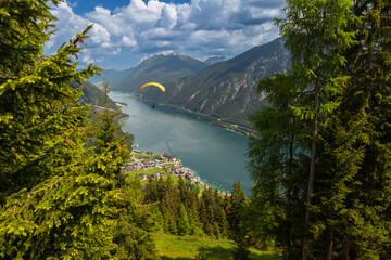 paraglider flyying in the alps at Achensee in austria 