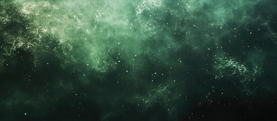 Fototapeta premium Abstract green cosmic background with stars and nebula, suitable for use as a wallpaper or design element, featuring ample copy space.