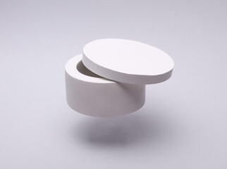 White plaster candle box on grey background