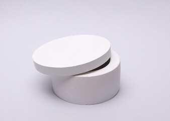 White plaster candle box on grey background