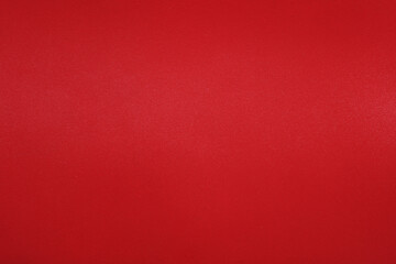 Red texture of genuine leather close up