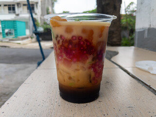 Layered Dessert Drink Creamy Delight with Colorful Spheres