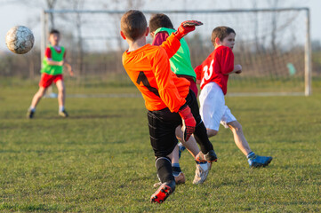 Boys play soccer sports field