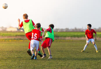 Boys play soccer sports field