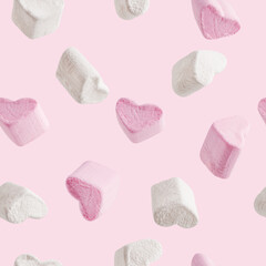Seamless pattern made of homemade sweet marshmallow snack dessert of heart shape made of sugar and...