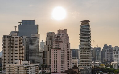 Fototapeta premium View of Bangkok skyline at sunset highlighting modern architecture and vibrant city life