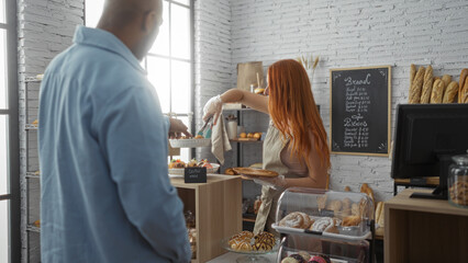 Woman serving bread to customer in bakery