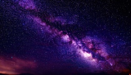 Naklejka premium breathtaking view of the milky way galaxy with vibrant purple hues and star clusters, perfect for celestial or cosmic themed projects