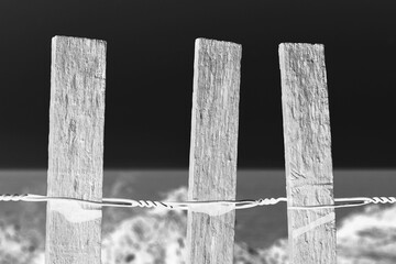 old wooden fence in black and white film negative