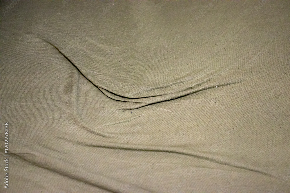 Poster close-up of a wrinkled fabric surface, creating a soft, elegant texture. perfect for backgrounds or 