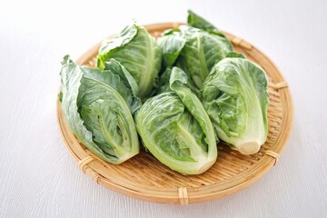 Brussels Sprouts in basket on white background