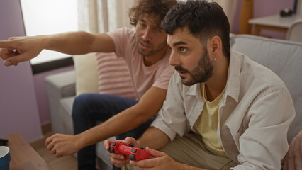 Men playing video games together in a living room, showcasing their close relationship and shared hobby as friends or brothers in a comfortable home setting.